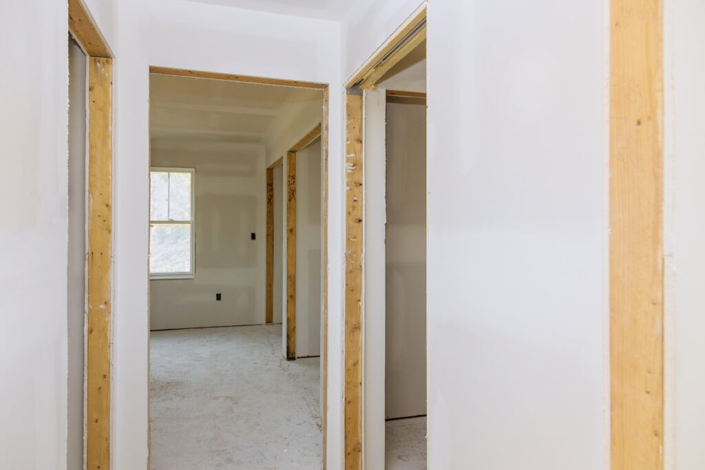 finishing putty in the room walls plasterboards with room under construction