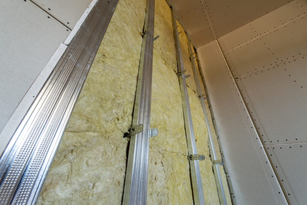 wall of a room under renovation with mineral rock wool insulatio